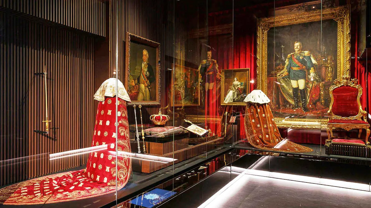 Royal crown jewels and gold silverware in a display case at the Royal Treasure Museum, a Lisbon museum ticket, one of the museums in Lisbon