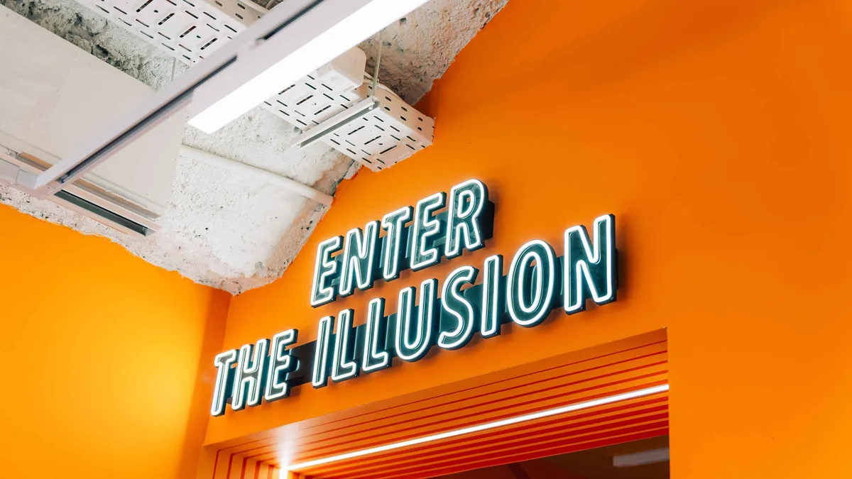 The orange Enter the Illusion wall at the Museum of Illusions in Chiado, one of the museums in Lisbon